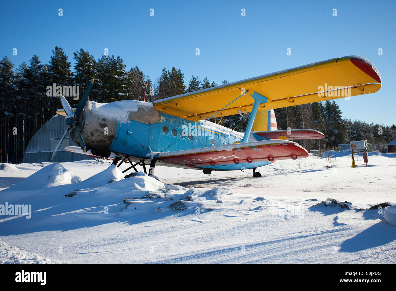 Old double-decker aeroplane standing in the snow Stock Photo