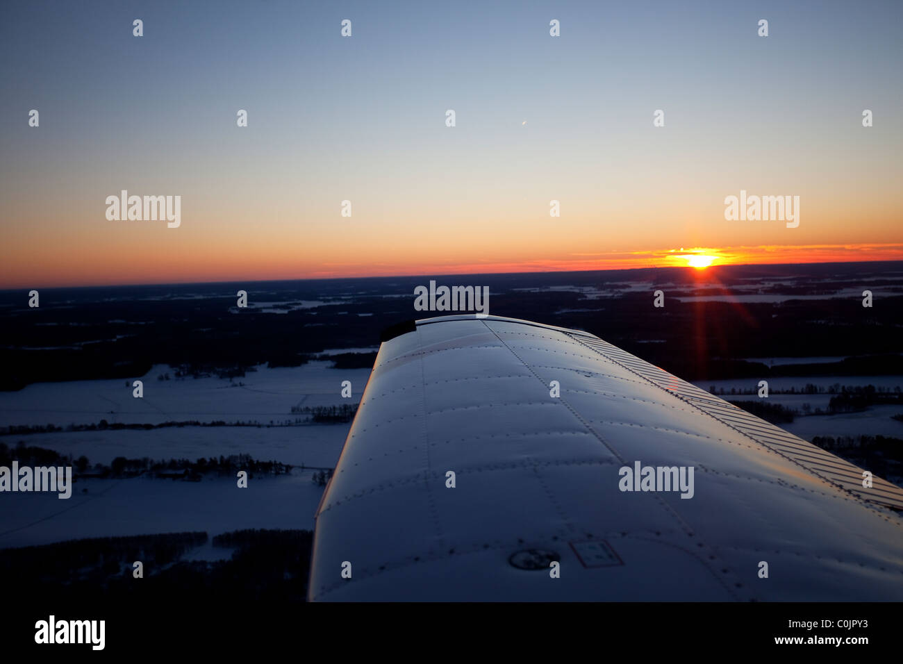 Sunrise from inside of a small aeroplane Stock Photo