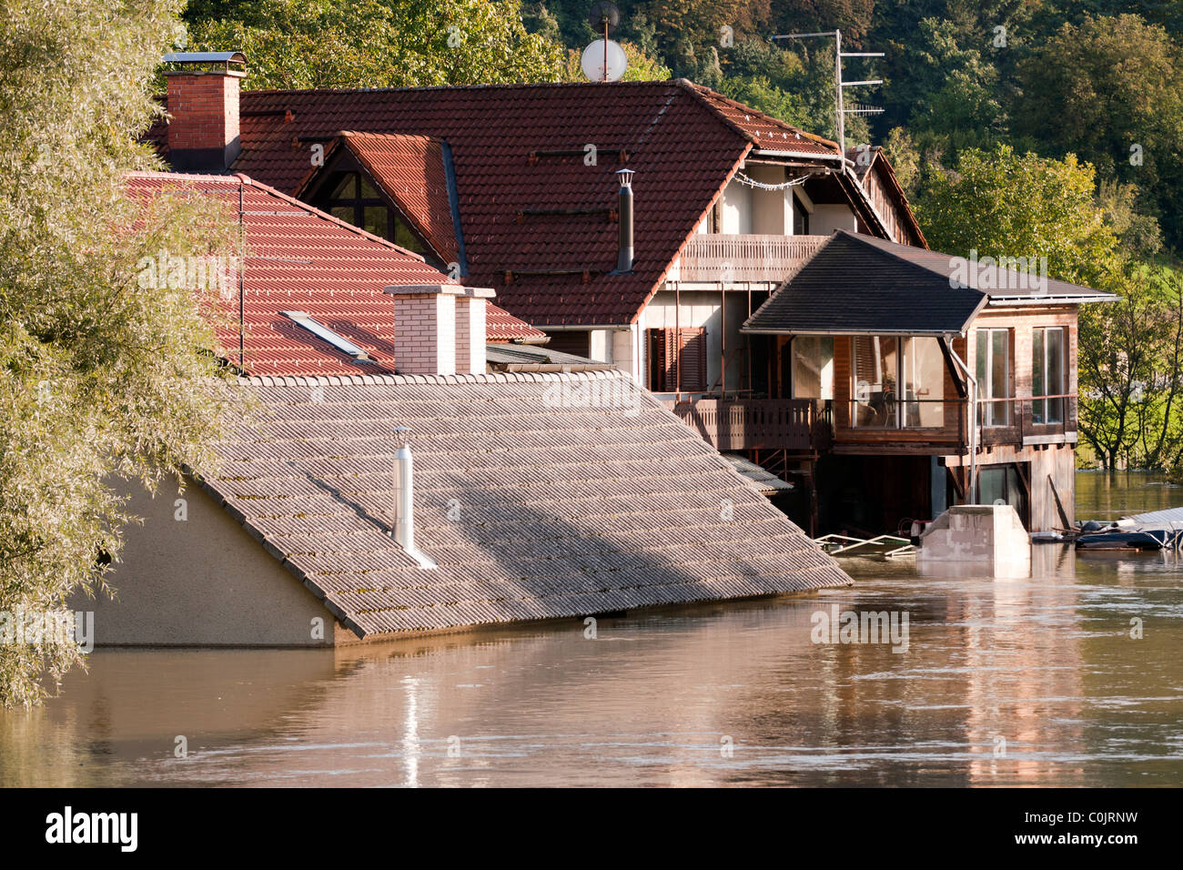 Flooding waters of river Sava and Krka in Slovenia, September 2010 with house under water to the roof. Stock Photo