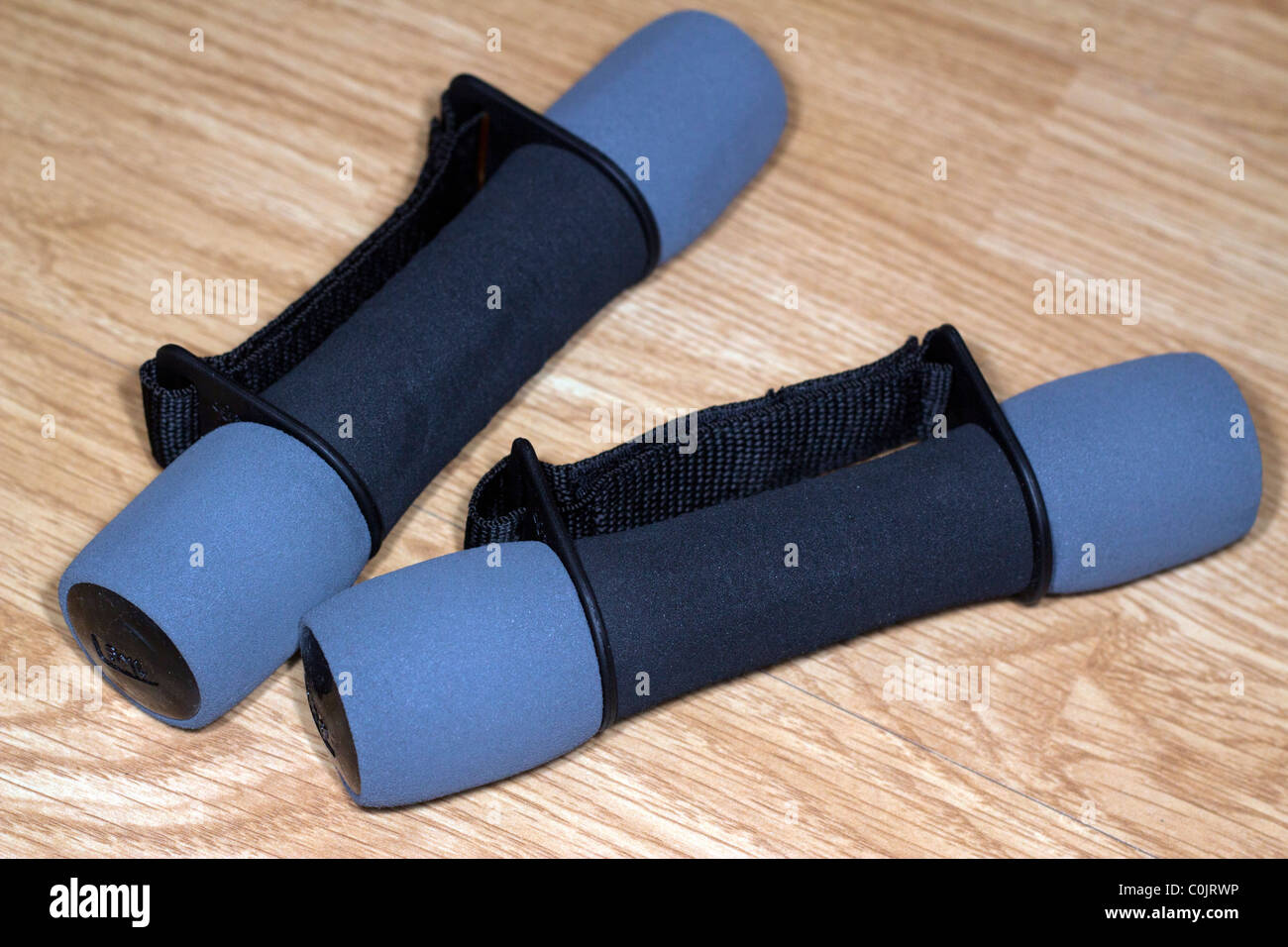 Light fitness lifting weights on the floor. Stock Photo