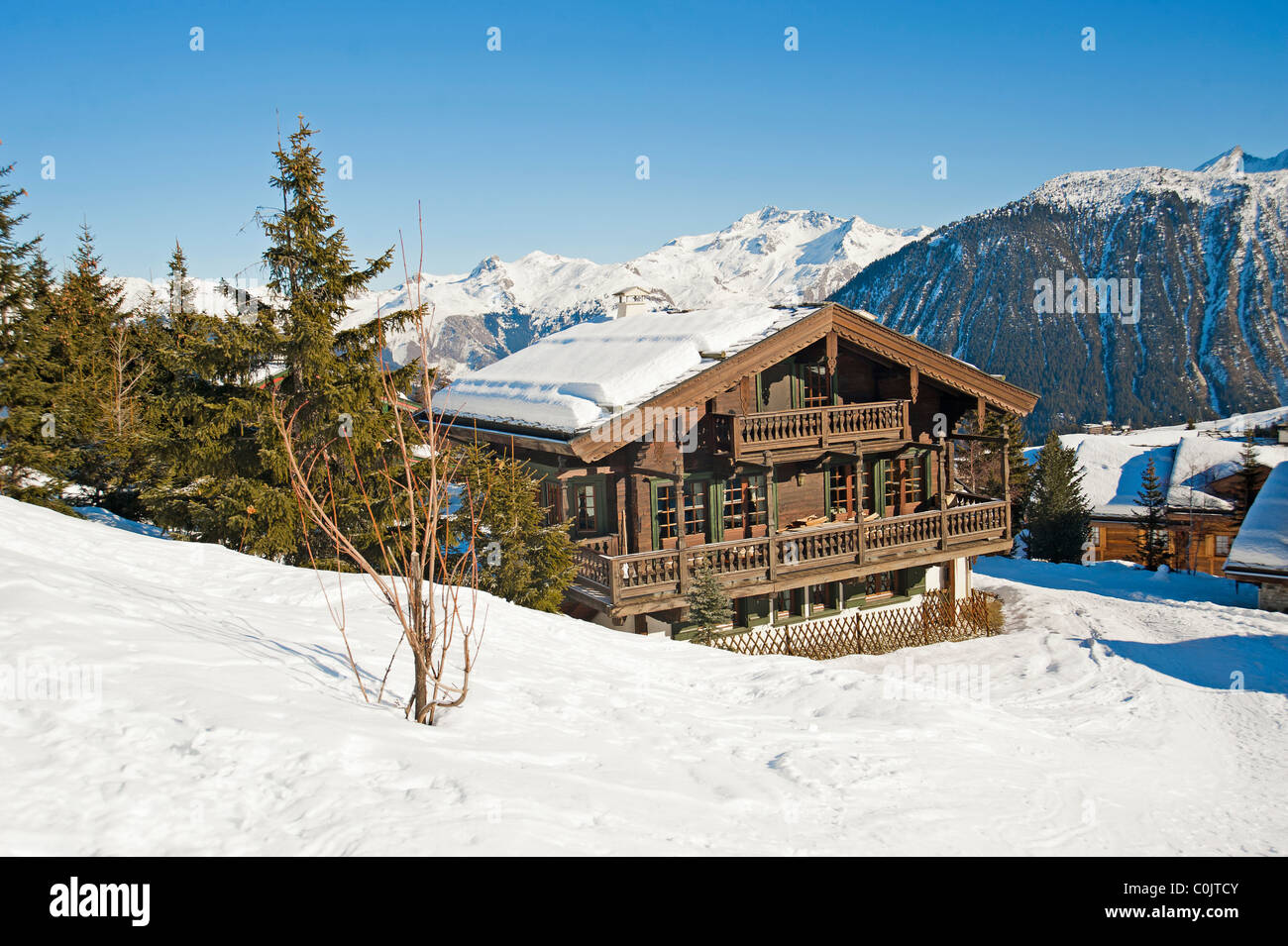 Mountain chalet in winter covered with snow Stock Photo