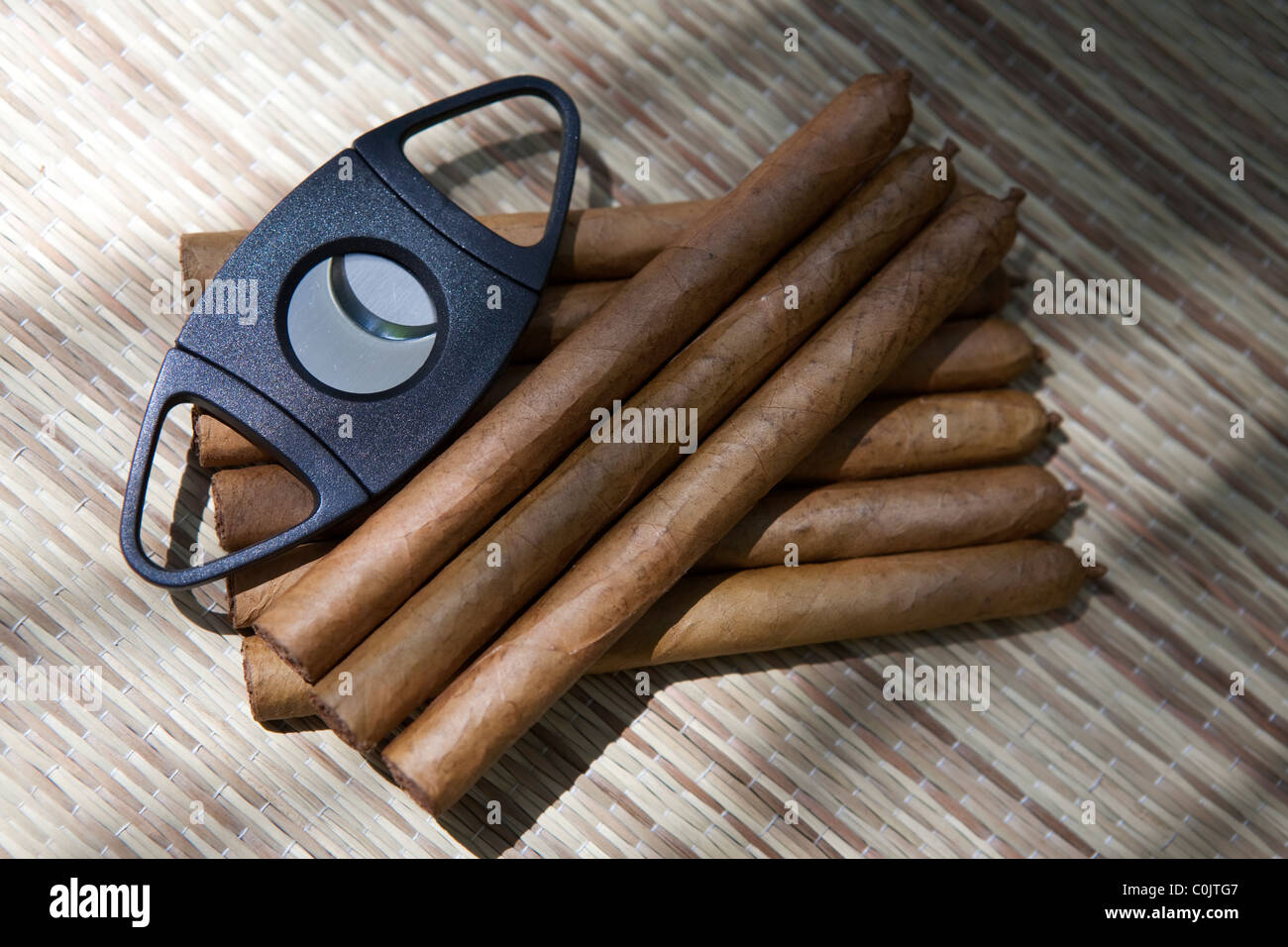 cigar cutter and brown tobacco cigars hand rolled island on island of La Palma Canary Islands Spain Stock Photo
