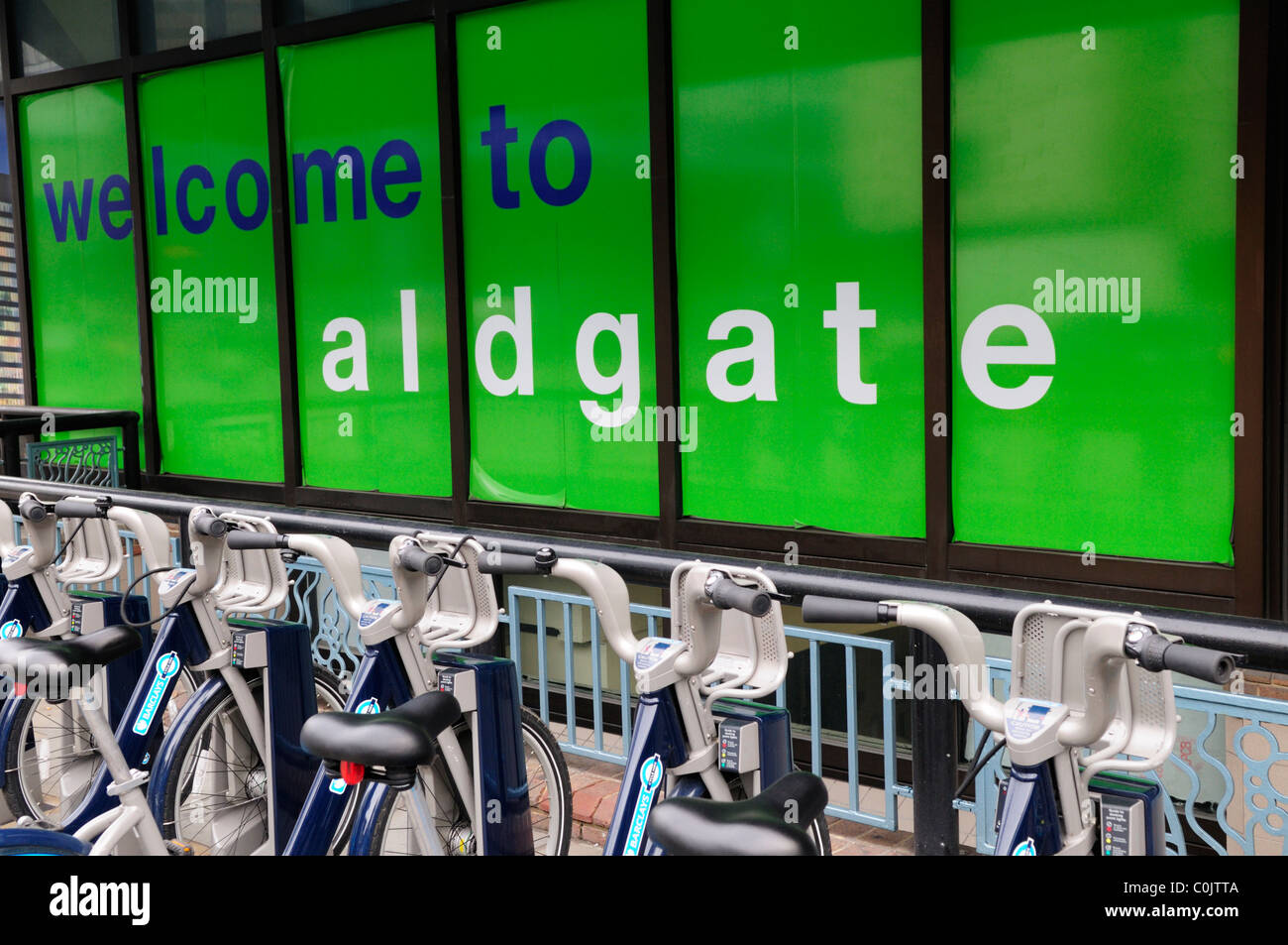 Welcome to Aldgate Sign with Barclays Cycle Hire Scheme Bicycles, Aldgate, London, England, UK Stock Photo