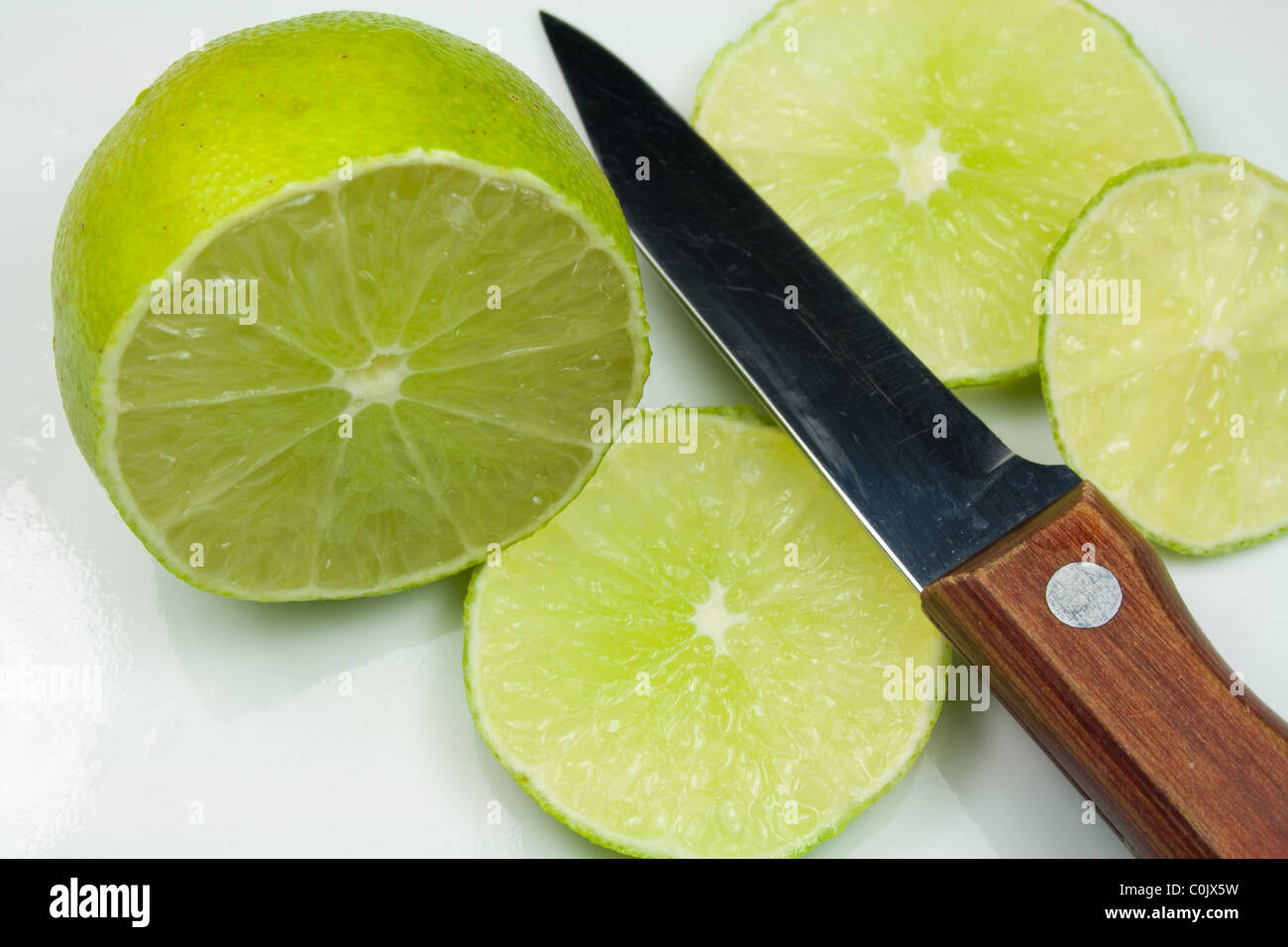 Sliced Lime Fruit and Knife Stock Photo Alamy