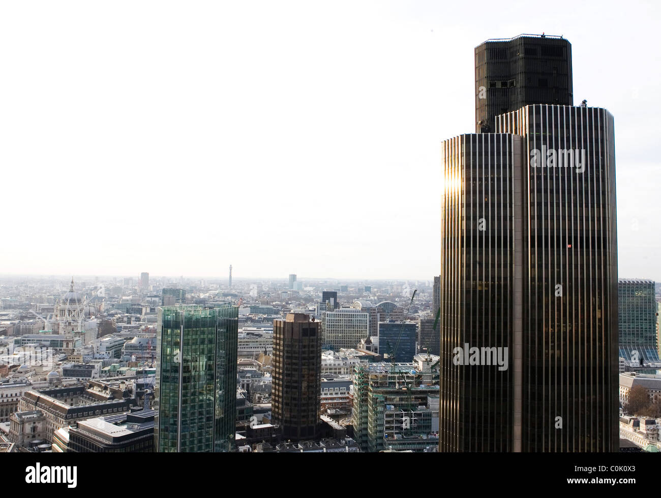 View of Tower 42, formerly Natwest Tower, with the city of London in the background. Stock Photo
