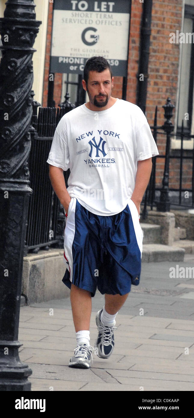 Adam Sandler out and about dressed in huge blue shorts and an oversized