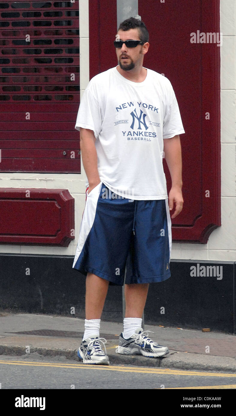 Adam Sandler out and about dressed in huge blue shorts and an oversized