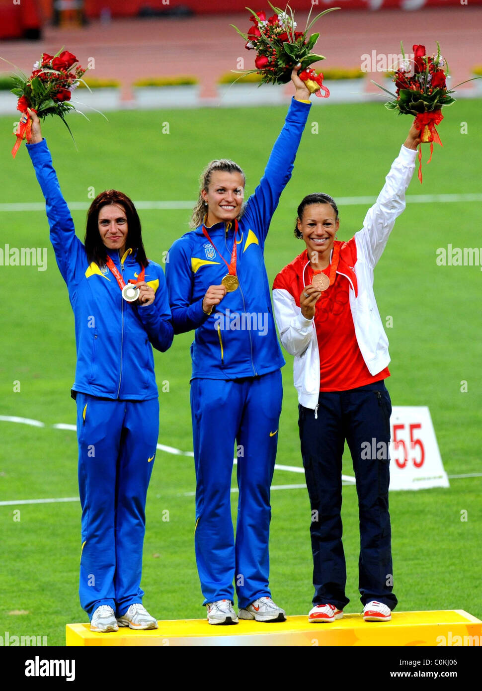 Nataliia Dobrynska of Ukraine (C) displays her gold medal on the ...