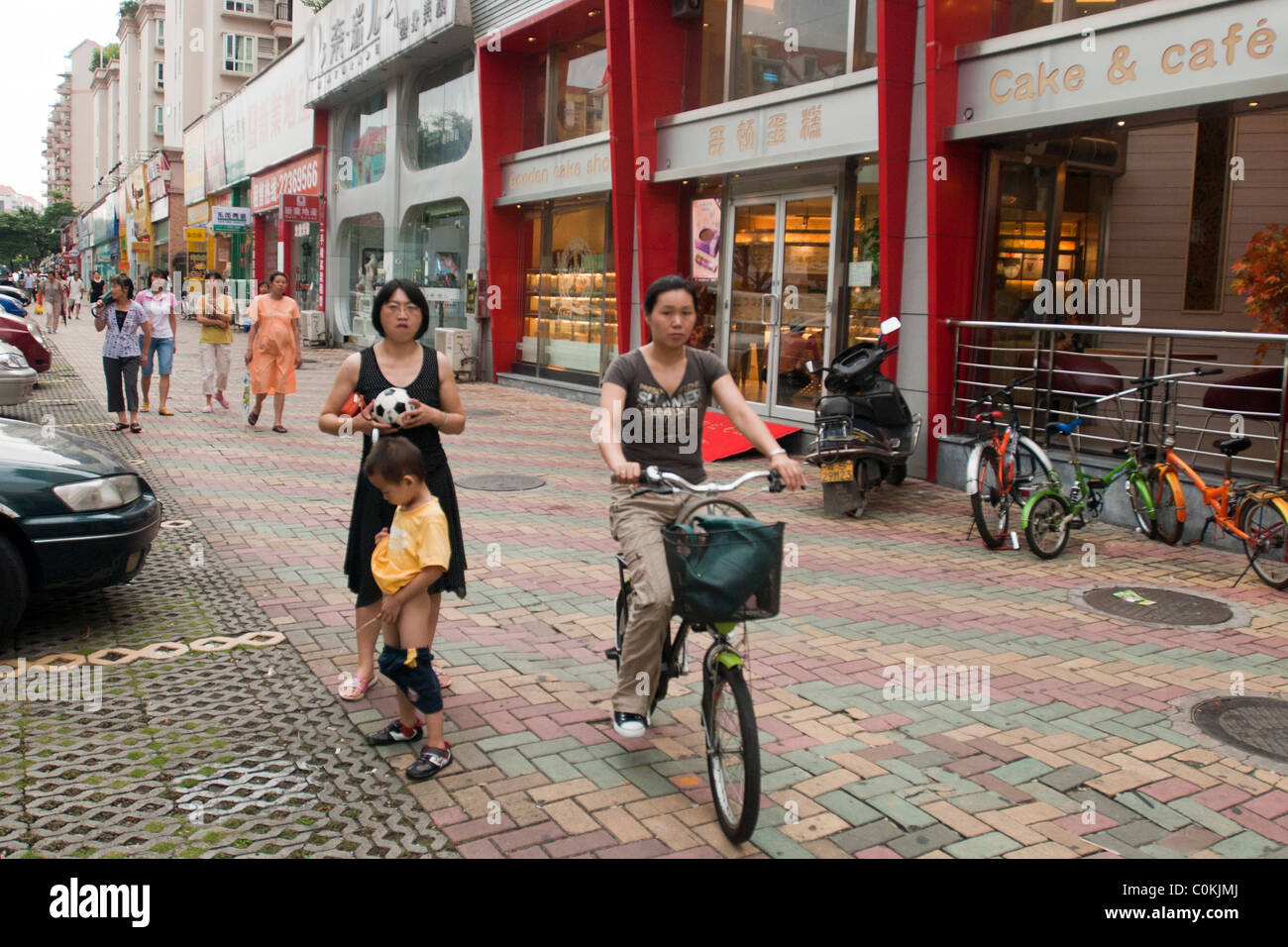 peeing china Little Chinese boy peeing on a pavement with his mother waiting for him and  people passing by Stock Photo - Alamy