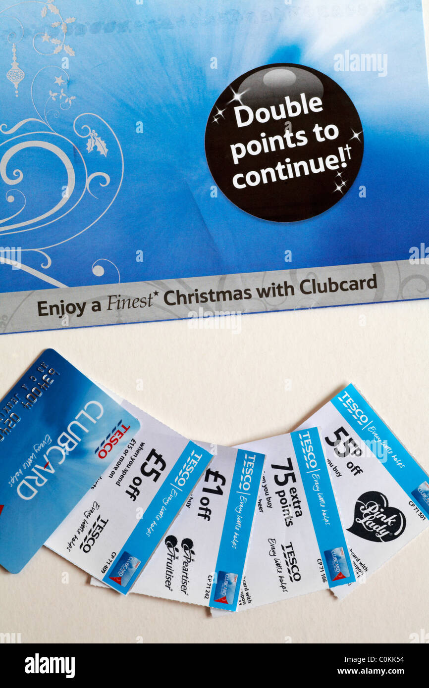 Tesco clubcard and money off vouchers on white background Stock Photo