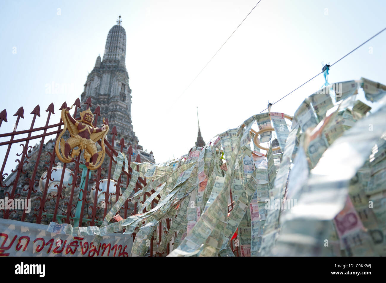 Paper money blessings decorate the temple of Wat Arun in Bangkok. Stock Photo