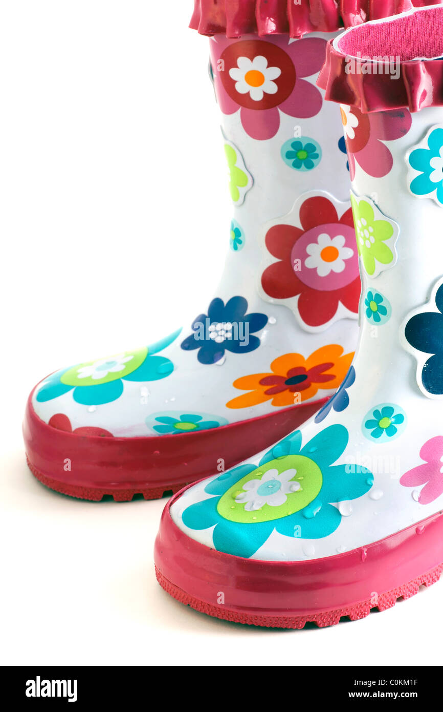 Fun little girl's colorful flower rain boots isolated on white. Stock Photo