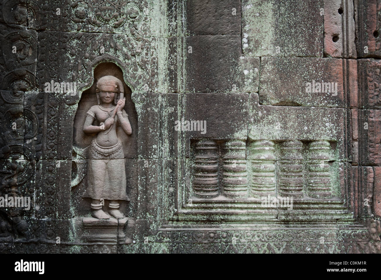 An ancient carving on the temple walls of Ta Som in Angkor, Cambodia. Stock Photo