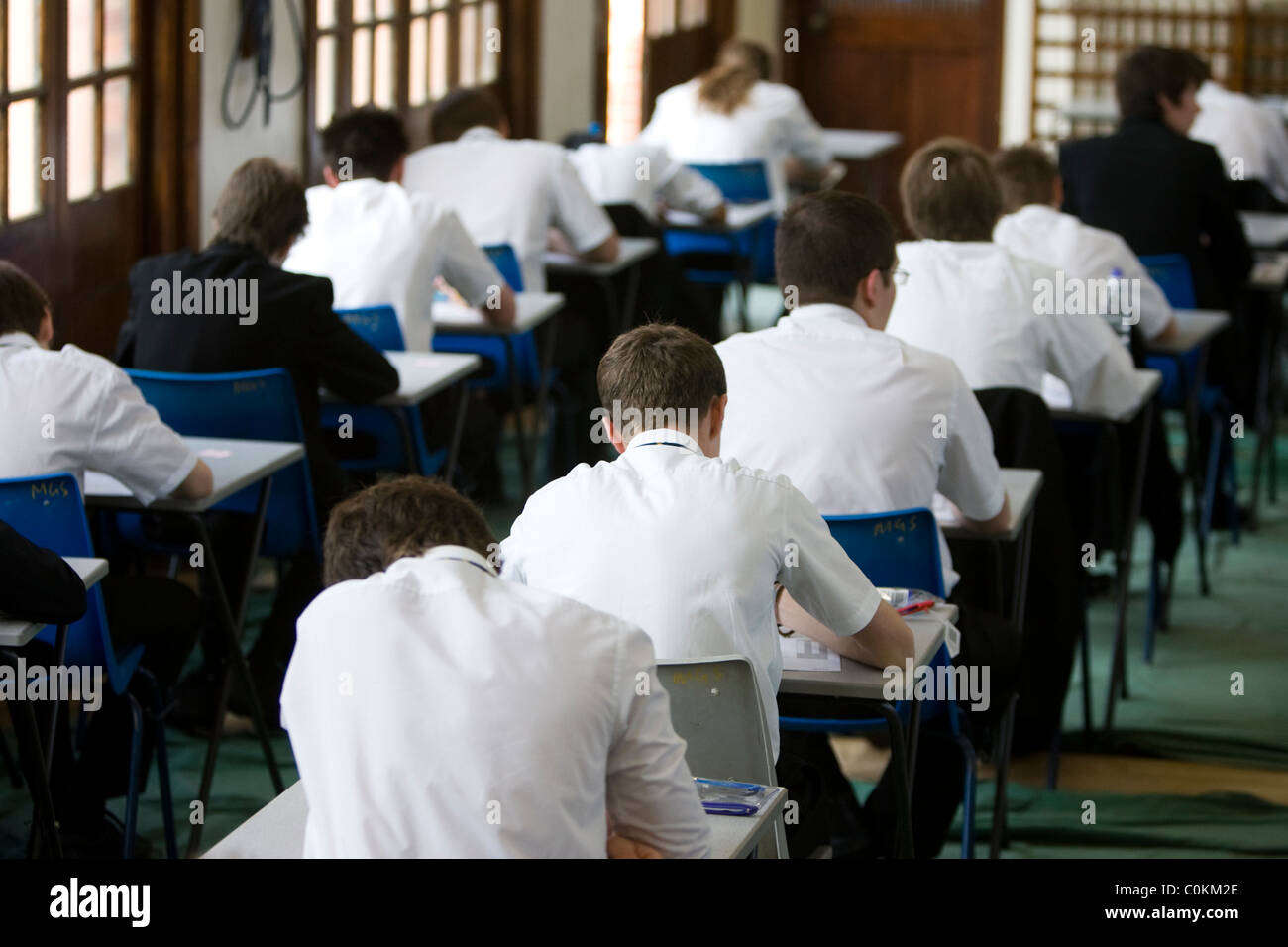 Pupils fill an exam hall to take a GCSE exam at Maidstone Grammar school in Maidstone, Kent, U.K. Stock Photo