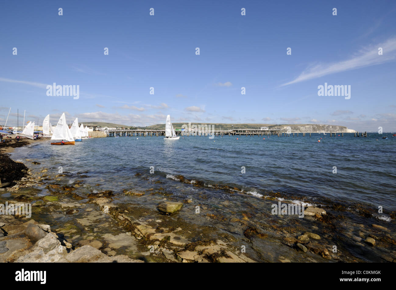 Sailing Boats in front of Swanage Pier in Dorset Stock Photo