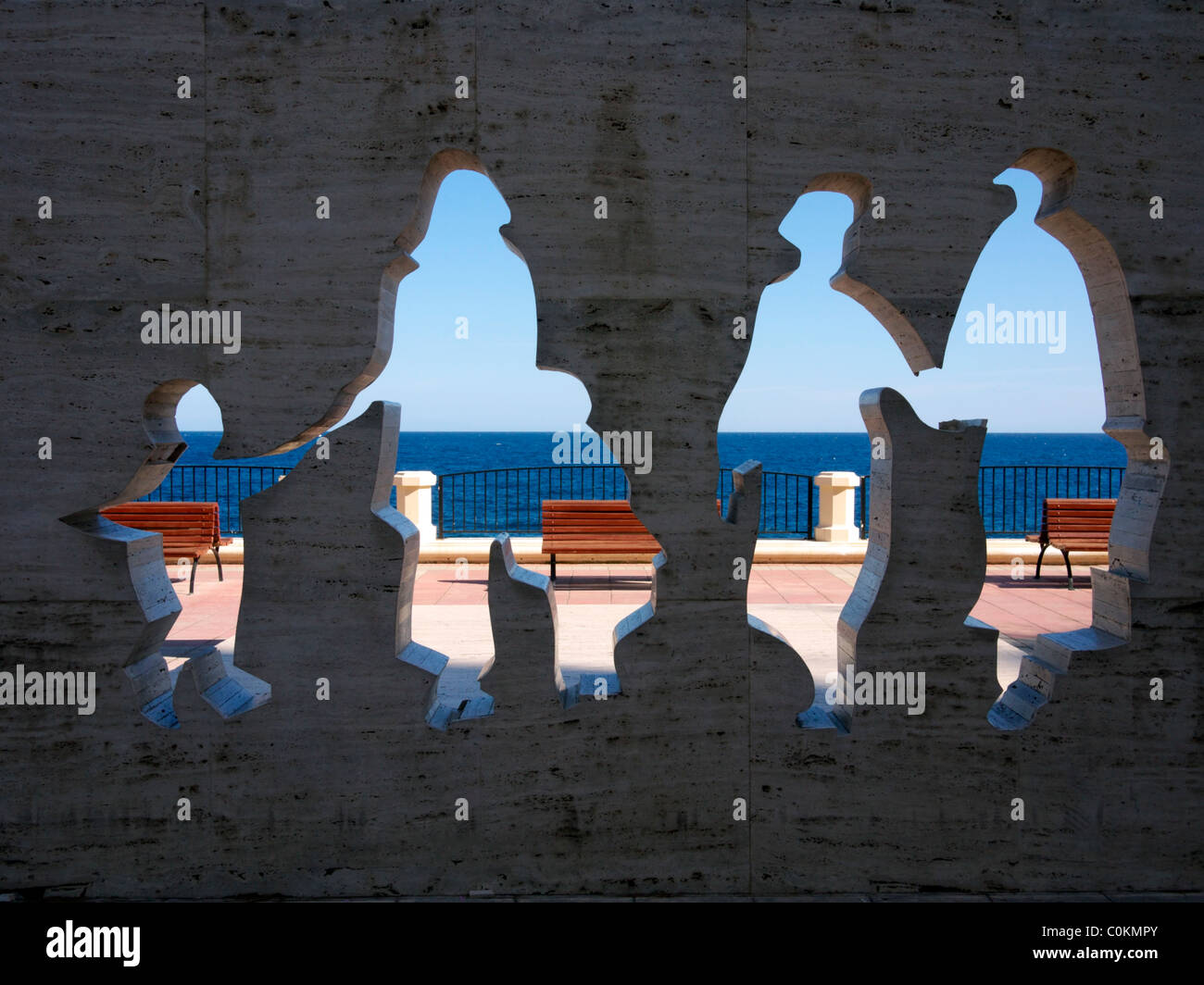 Family-themed sculpture at the beach promenade in Sliema, Malta Stock Photo