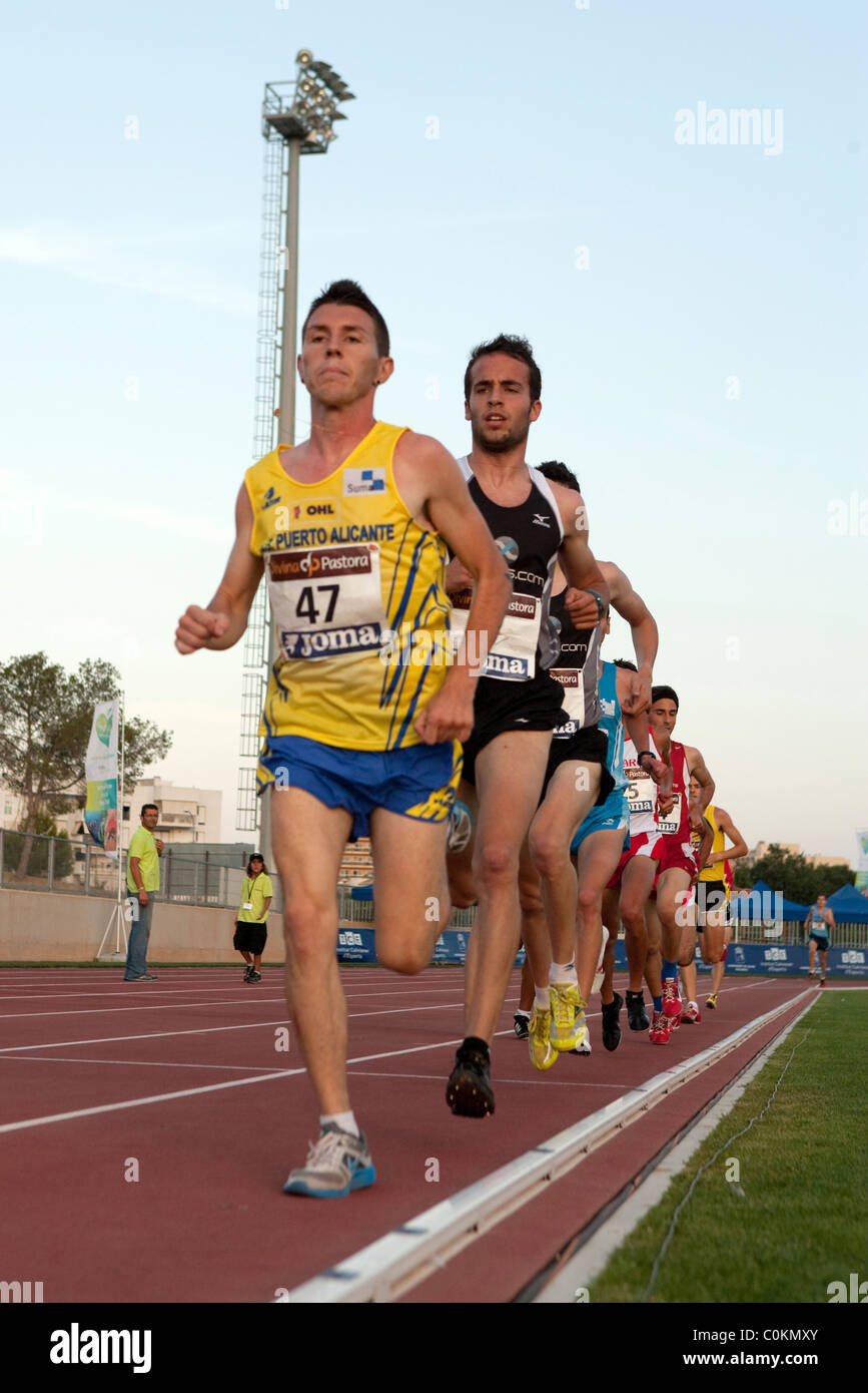 adult athletes running.Sport outdoor Athletics competition race track  Championships of Spain, July 3rd 4th 2010 Calvià Mallorca Stock Photo