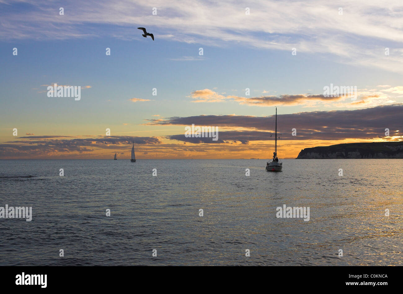 View of sailing boats entering Axmouth Harbour, Axmouth, Devon in October. Stock Photo
