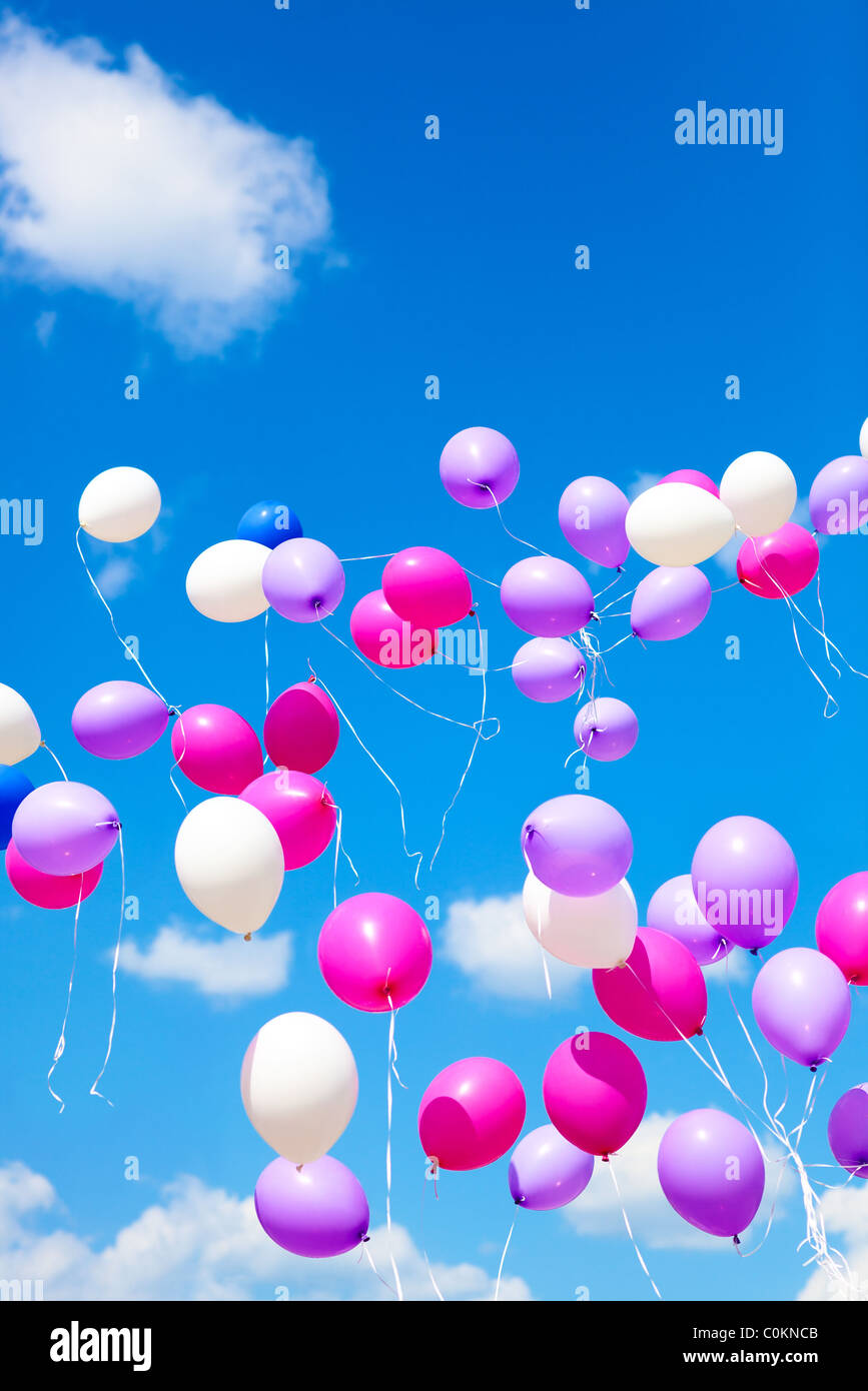 Holiday balloons on blue sky background. Stock Photo