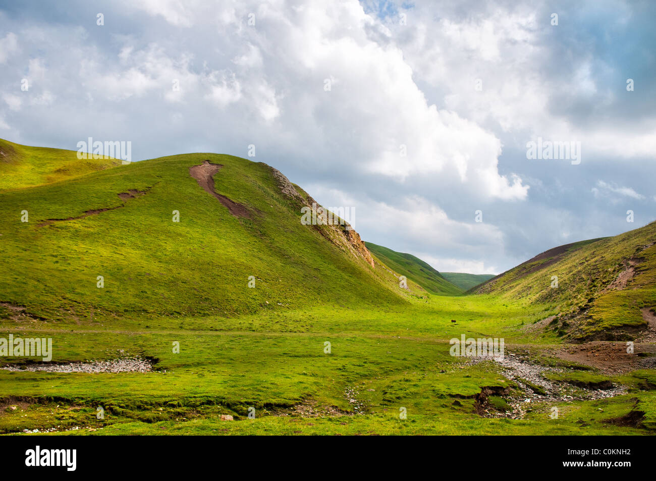 The steppes (rolling grassland) in Gansu province, Northwestern China Stock Photo