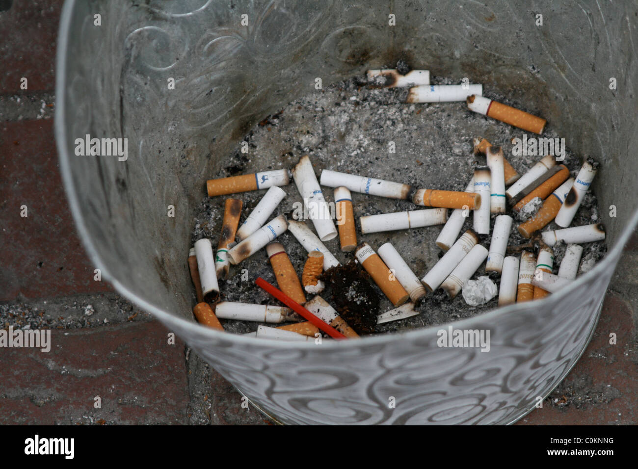 Cigarettes in a bucket Stock Photo Alamy