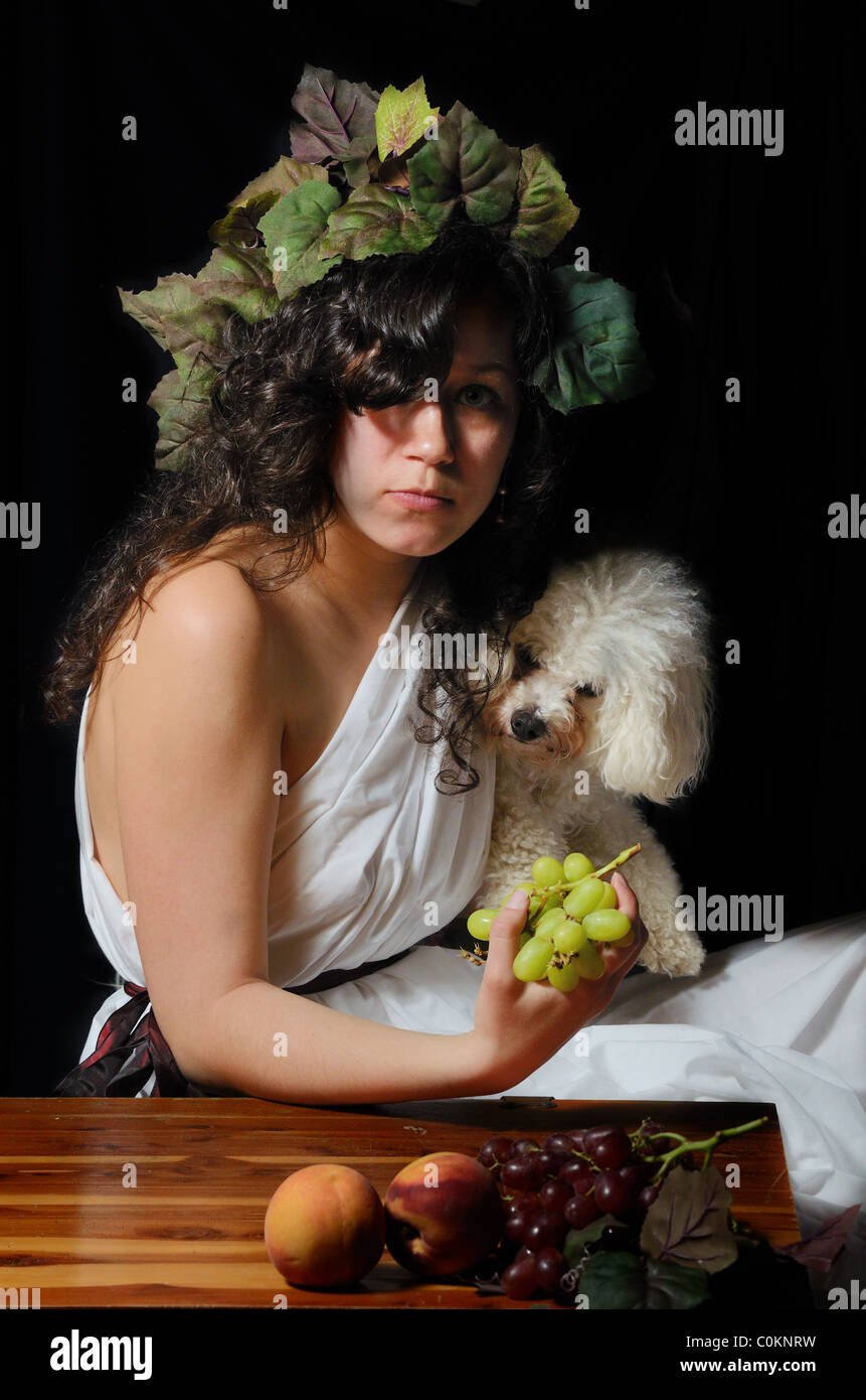 A beautiful women dressed as Dionysus the Greek god of the grape harvest. Stock Photo