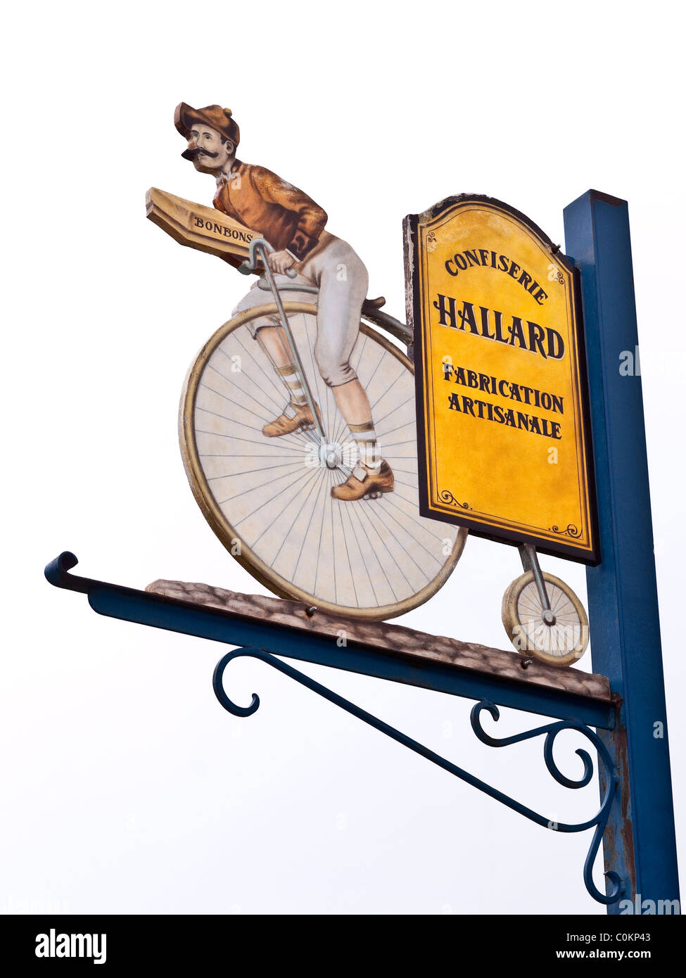 Penny-Farthing bicycle advertising sign for sweets manufacturer - France. Stock Photo