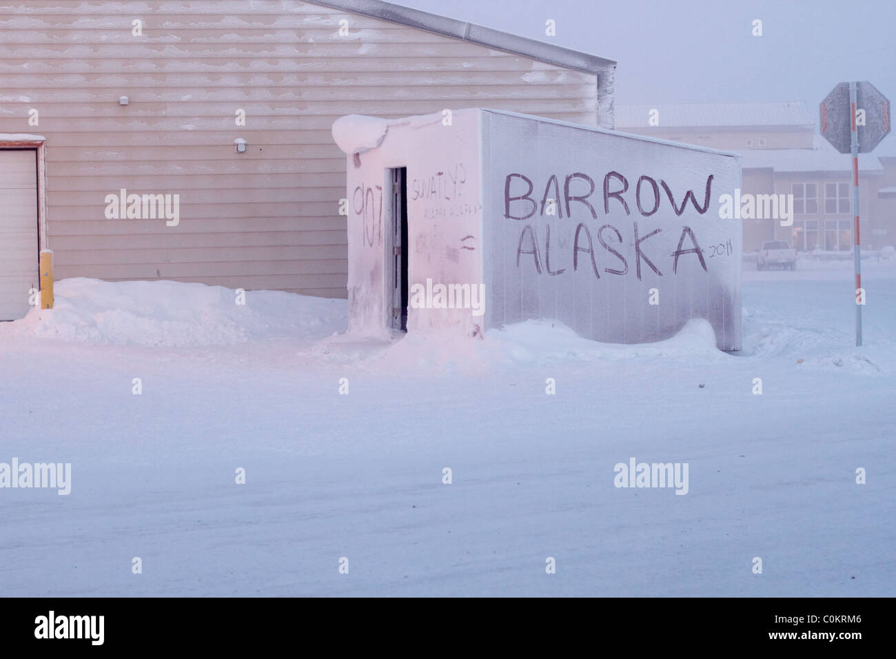 Barrow Alaska written in the snow and ice on a small shed just outside the hospital in Barrow, AK USA. Stock Photo