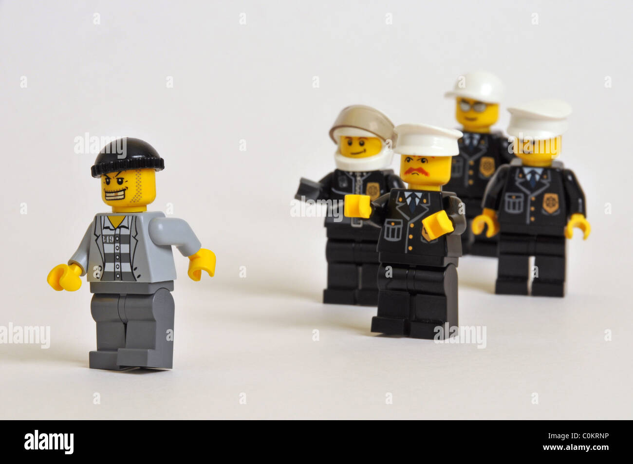 Police thieves cops robbers thief Lego Men plastic Stock Photo - Alamy