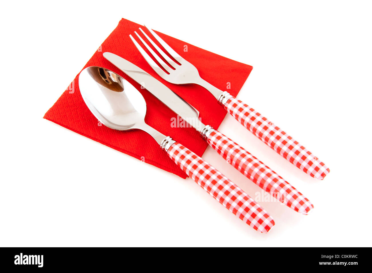 Red checkered cutlery with napkin isolated over white background Stock