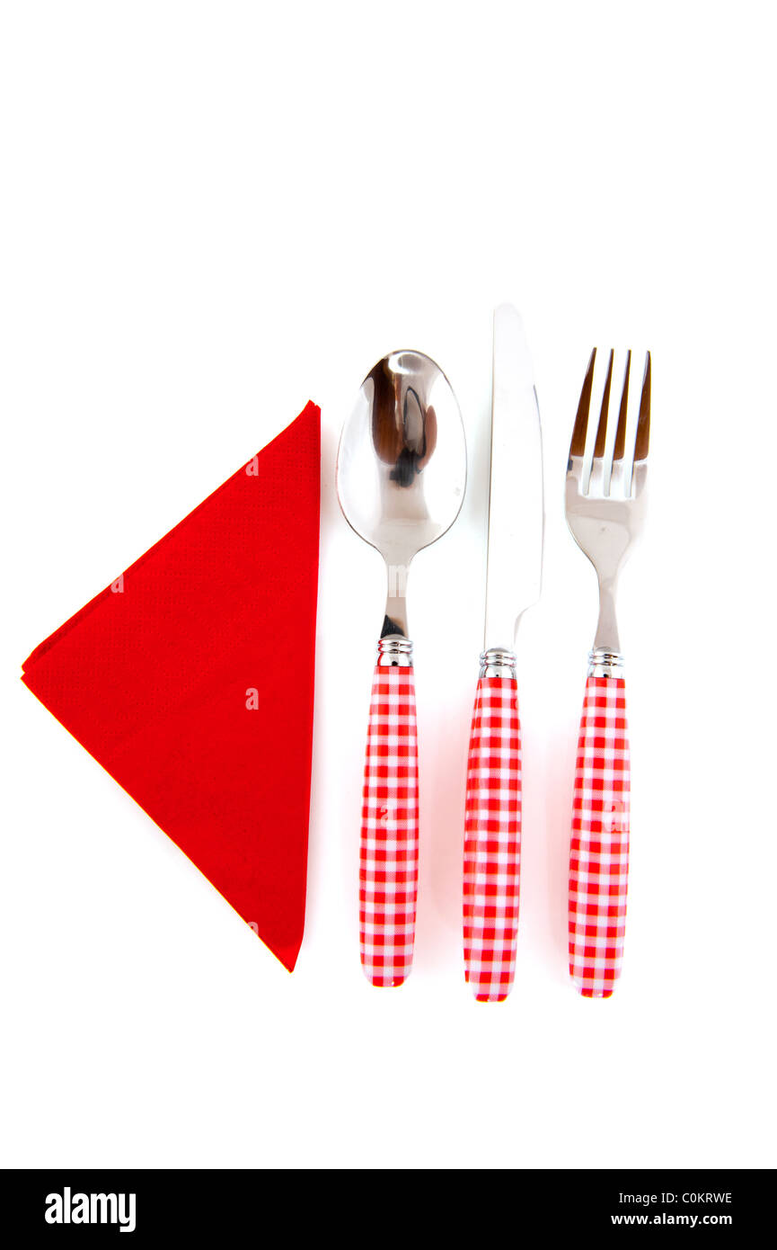Red checkered cutlery with napkin isolated over white background Stock
