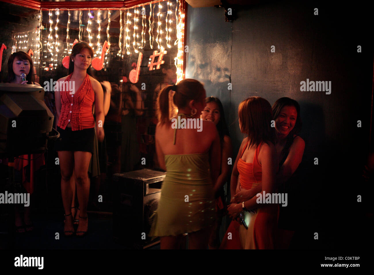 Girls frequenting a karaoke bar in Adriatico Street, Malate, Manila