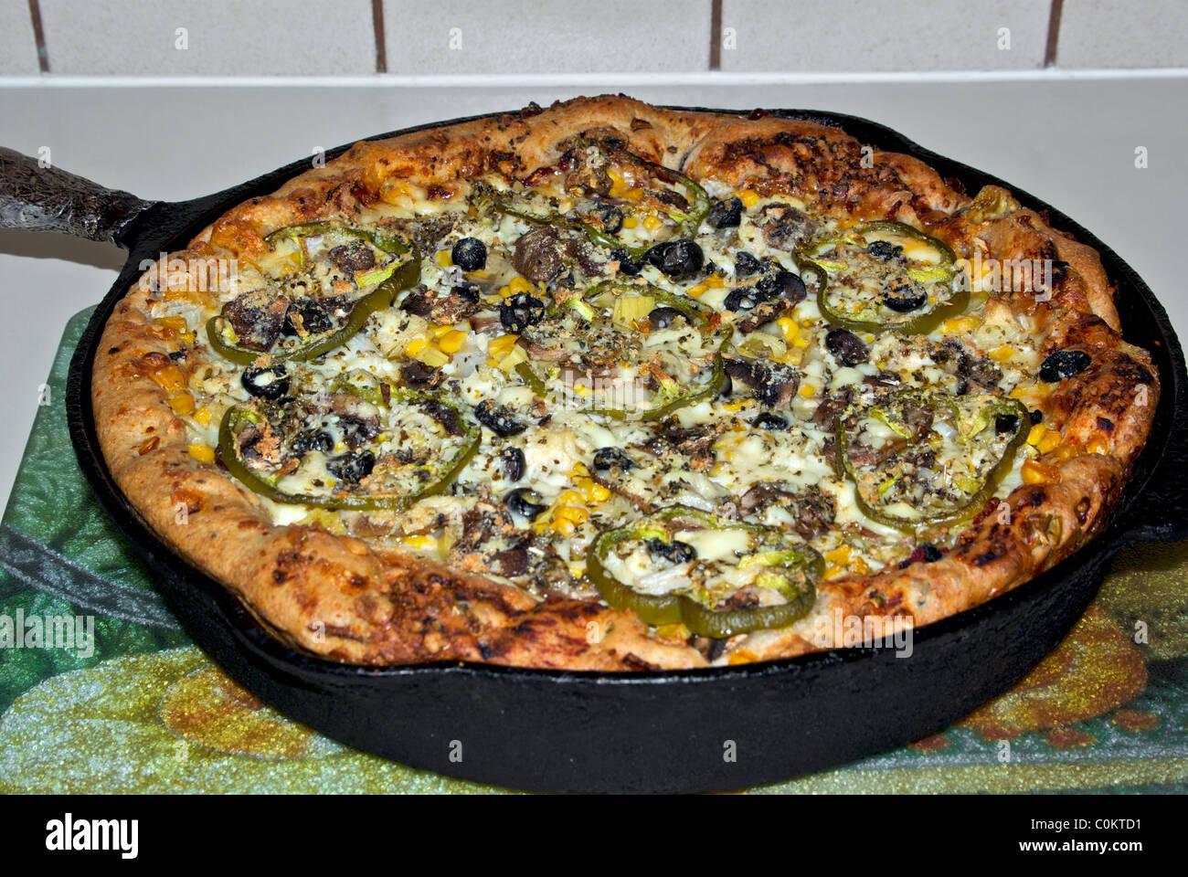 large homemade deep dish thick crust cast iron frying pan baked