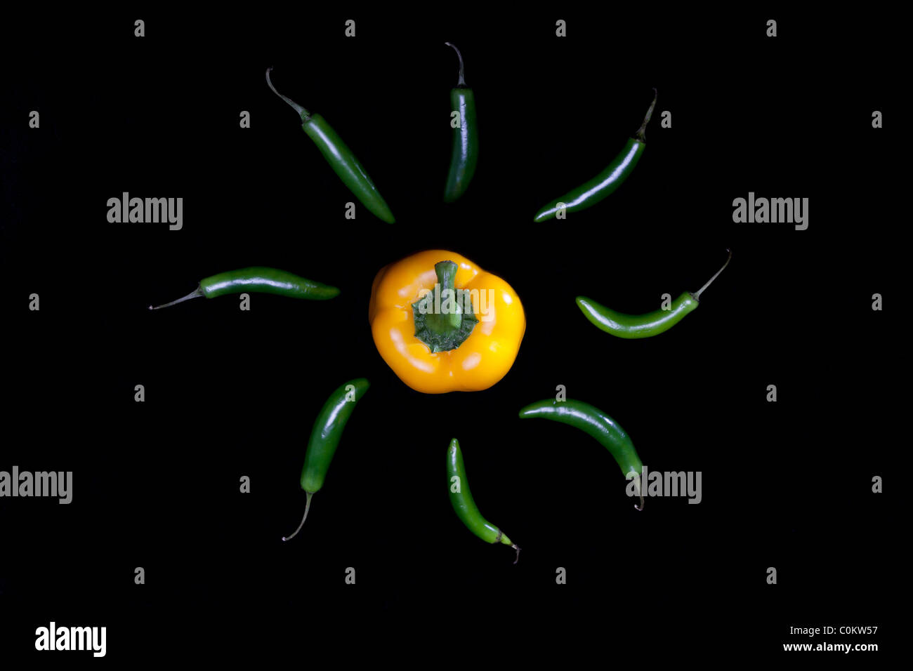 Sun with rays, made with yellow bell pepper and serrano chilis. Stock Photo