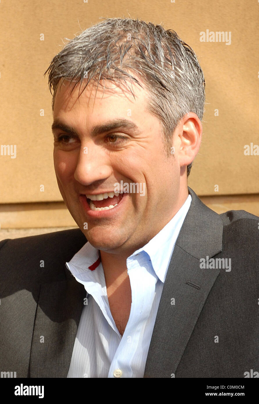 Taylor Hicks signs autographs for fans following his performance in the