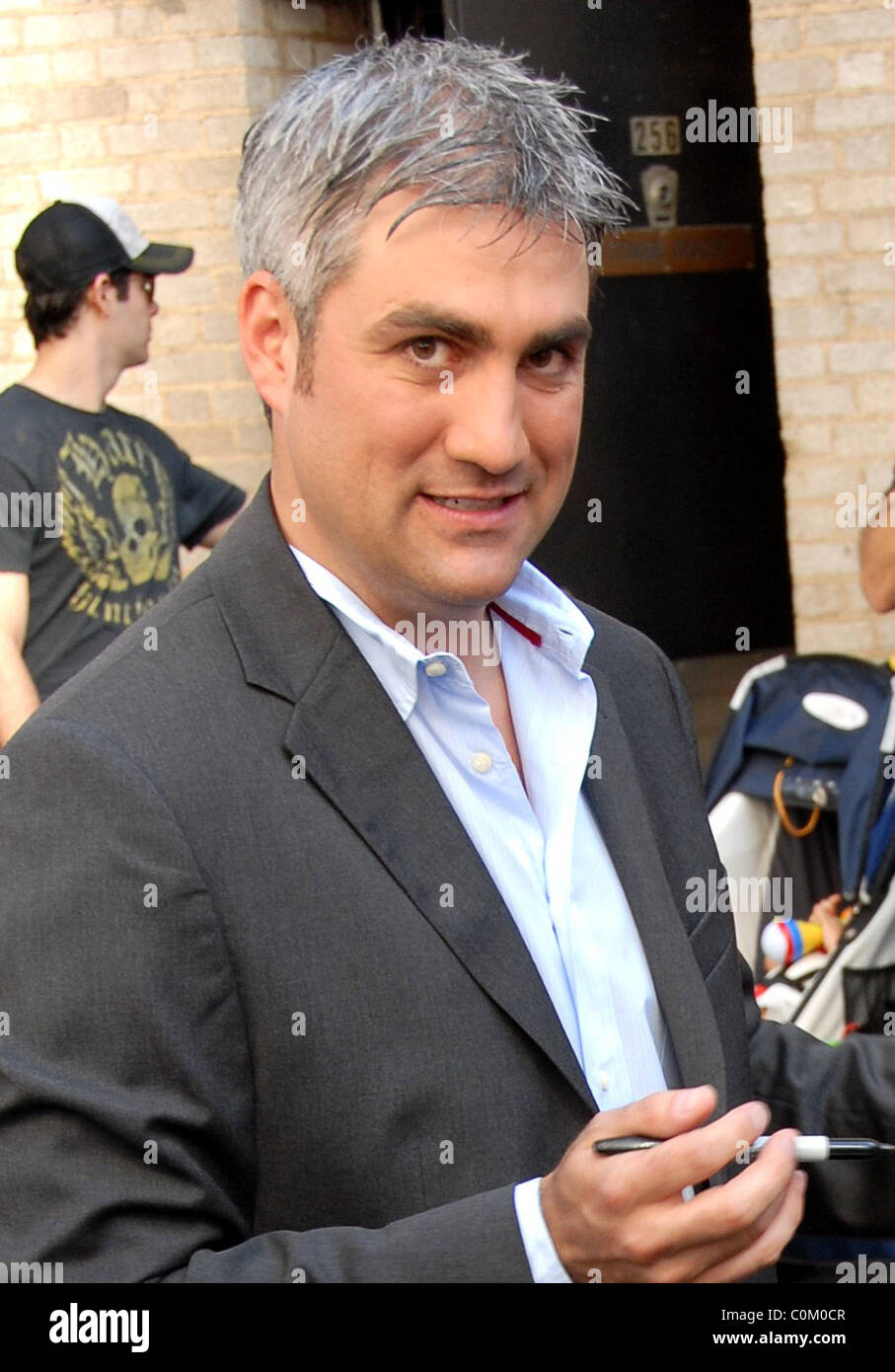 Taylor Hicks signs autographs for fans following his performance in the