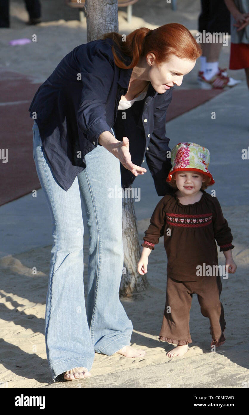 Marcia Cross takes her twin daughters Eden and Savannah to play in