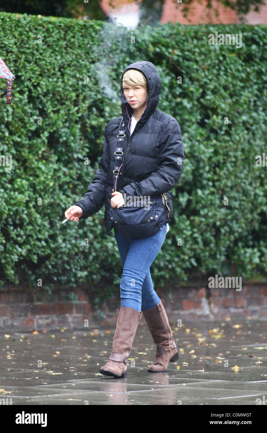 Ekaterina Ivanova Rolling Stone Ronnie Wood's alleged mistress takes a walk  in the rain in Belsize Park smoking a cigarette Stock Photo