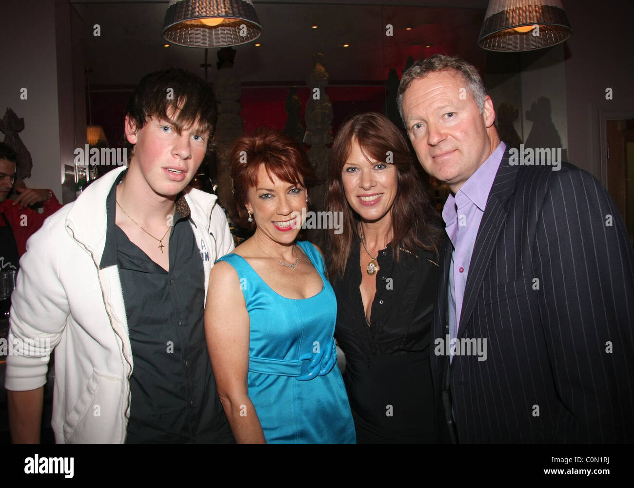 Annette's Son, Kathy Lette, Annette Mason and Rory Bremner attend the Kathy Lette Book Launch 'To Love Honour and Betray' held Stock Photo