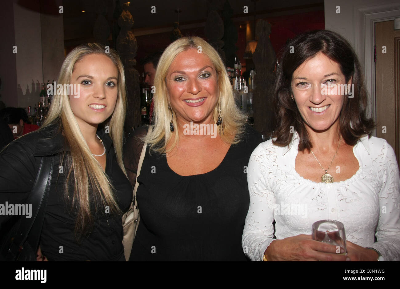 Allegra Feltz, Vanessa Feltz and Victoria Hislop attend the Kathy Lette Book Launch 'To Love Honour and Betray' held at the Stock Photo