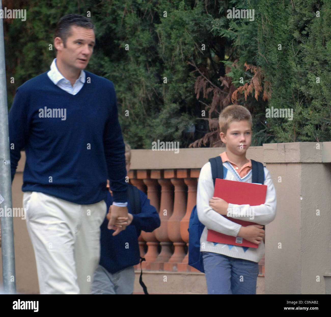 Inaki Urdangarin, husband of Infanta Cristina, walking his children to