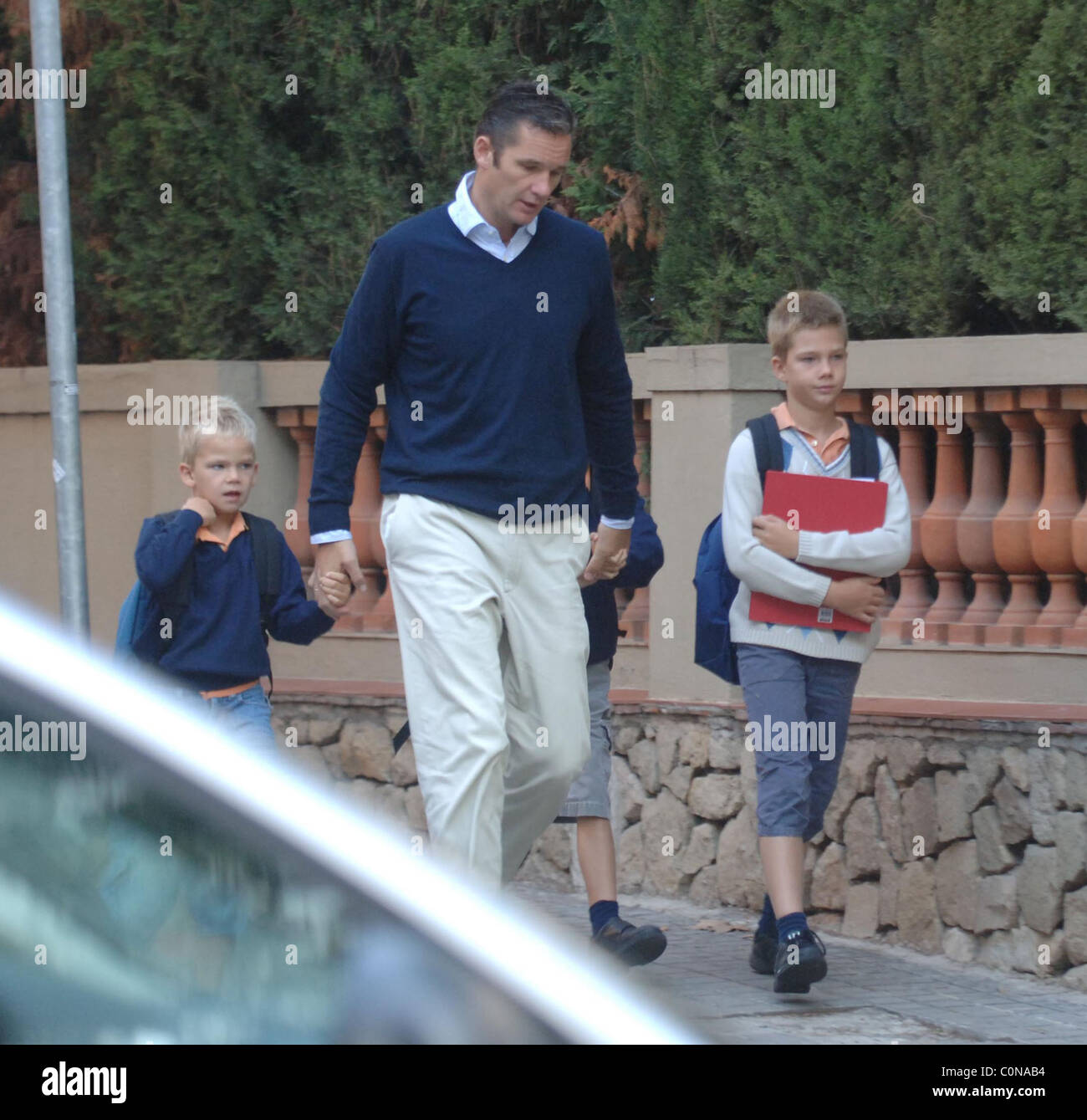 Inaki Urdangarin, husband of Infanta Cristina, walking his children to