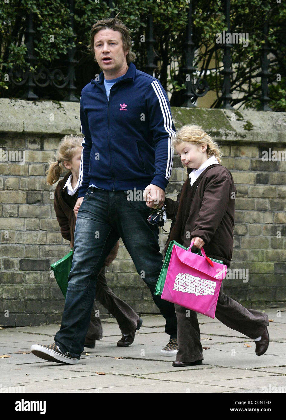 Jamie Oliver collecting his children, Poppy and Daisy, from school London, England - 14.10.08 Stock Photo