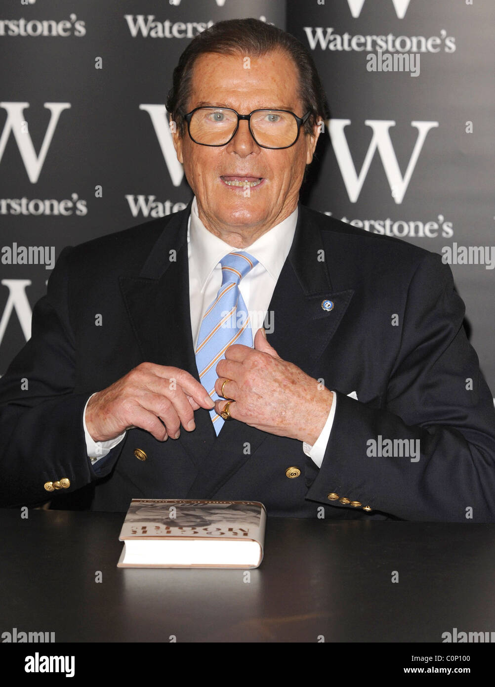 Roger moore signs copies of his book roger moore my word is my bond