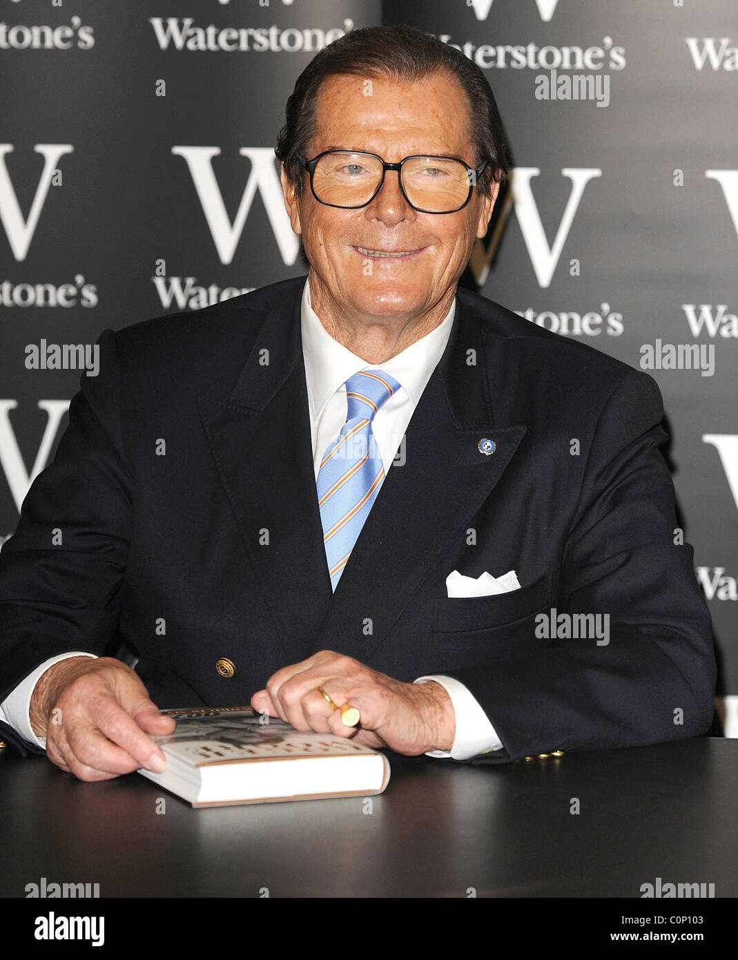 Roger moore signs copies of his book roger moore my word is my bond
