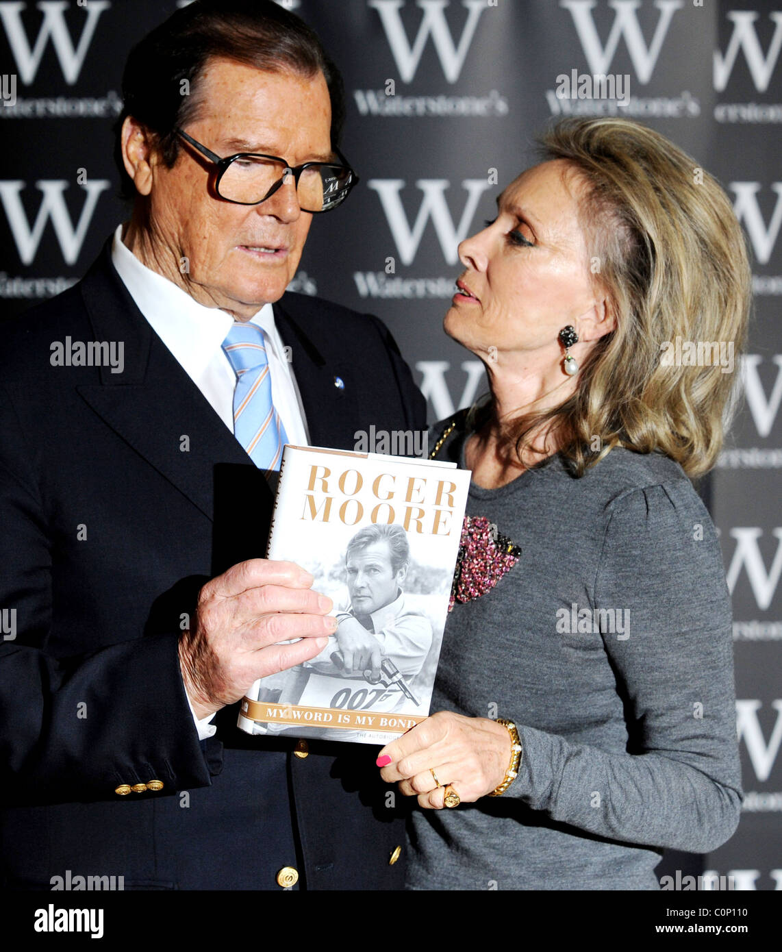 Roger moore signs copies of his book roger moore my word is my bond