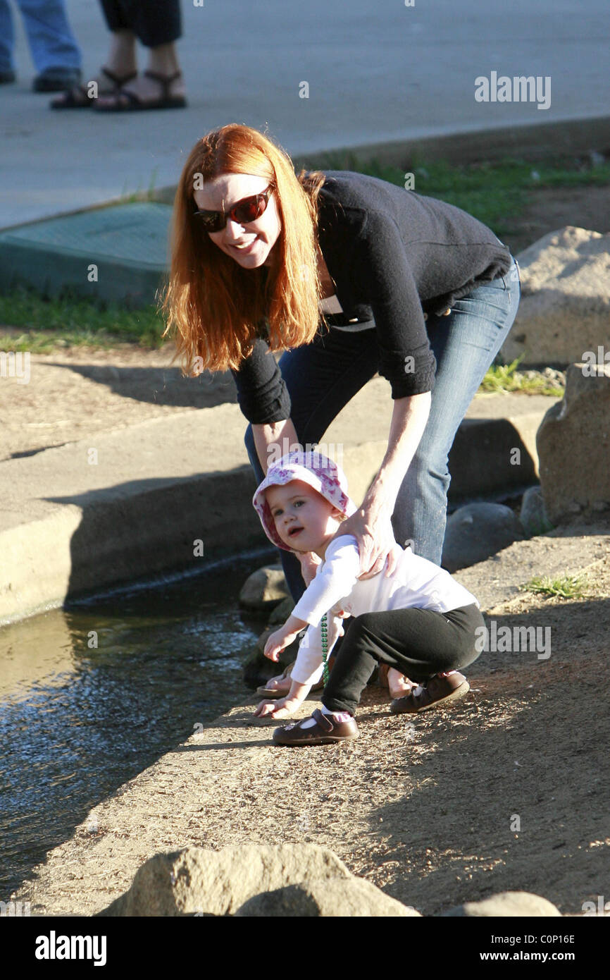 Marcia Cross takes her daughters Savannah and Eden to her local park