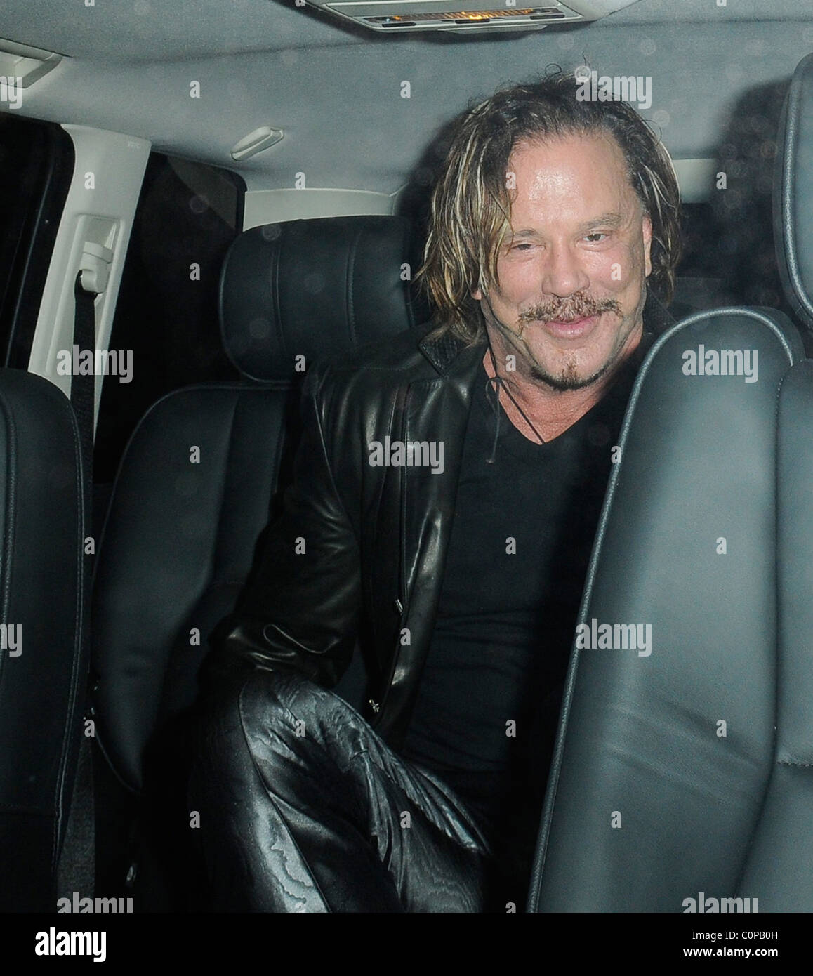 Mickey Rourke spends the night on the tiles with a mystery blonde. The ...