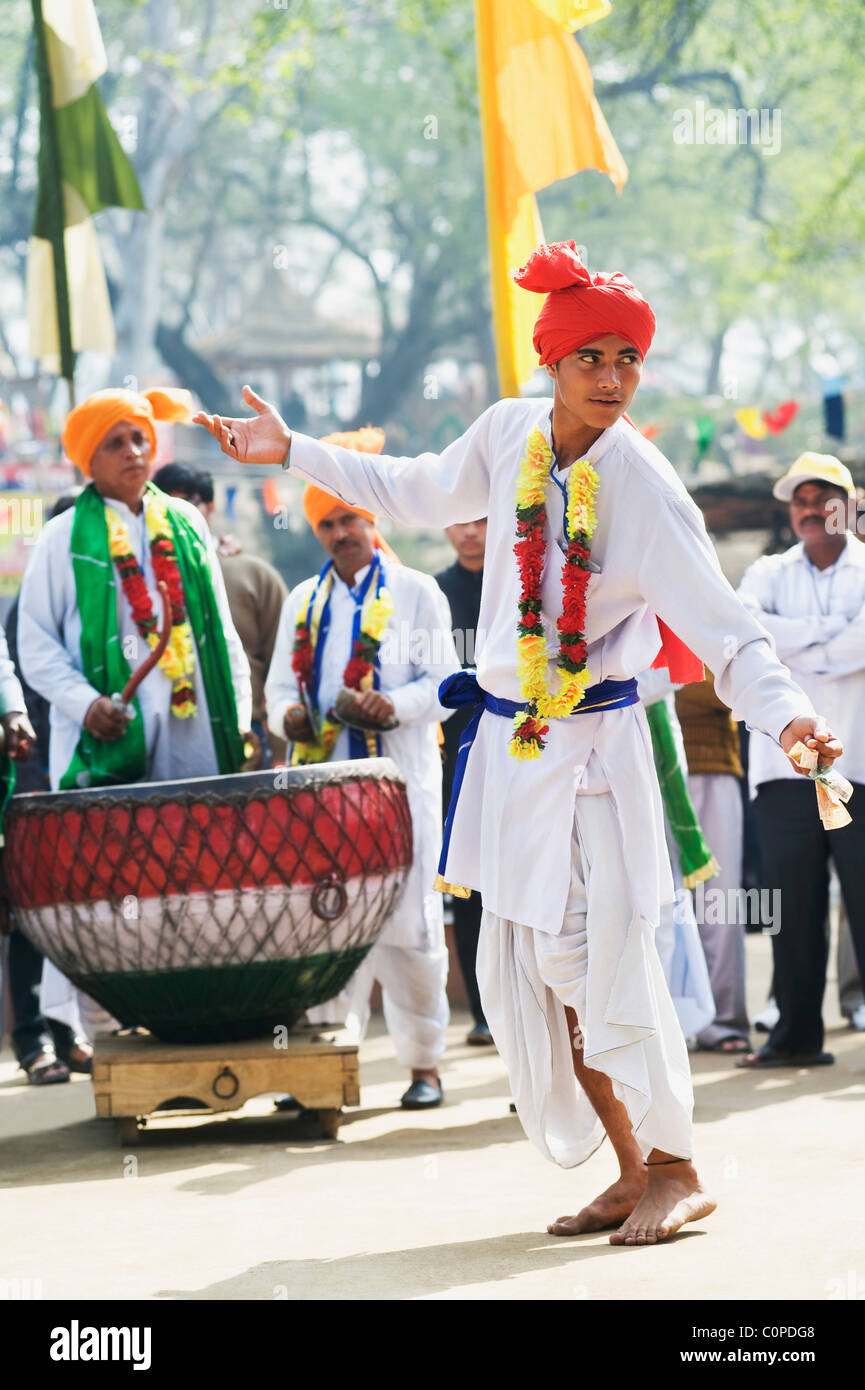 Traditional Indian folk dancer performing in a fair, Surajkund Crafts Mela, Surajkund, Faridabad District, Haryana, India Stock Photo