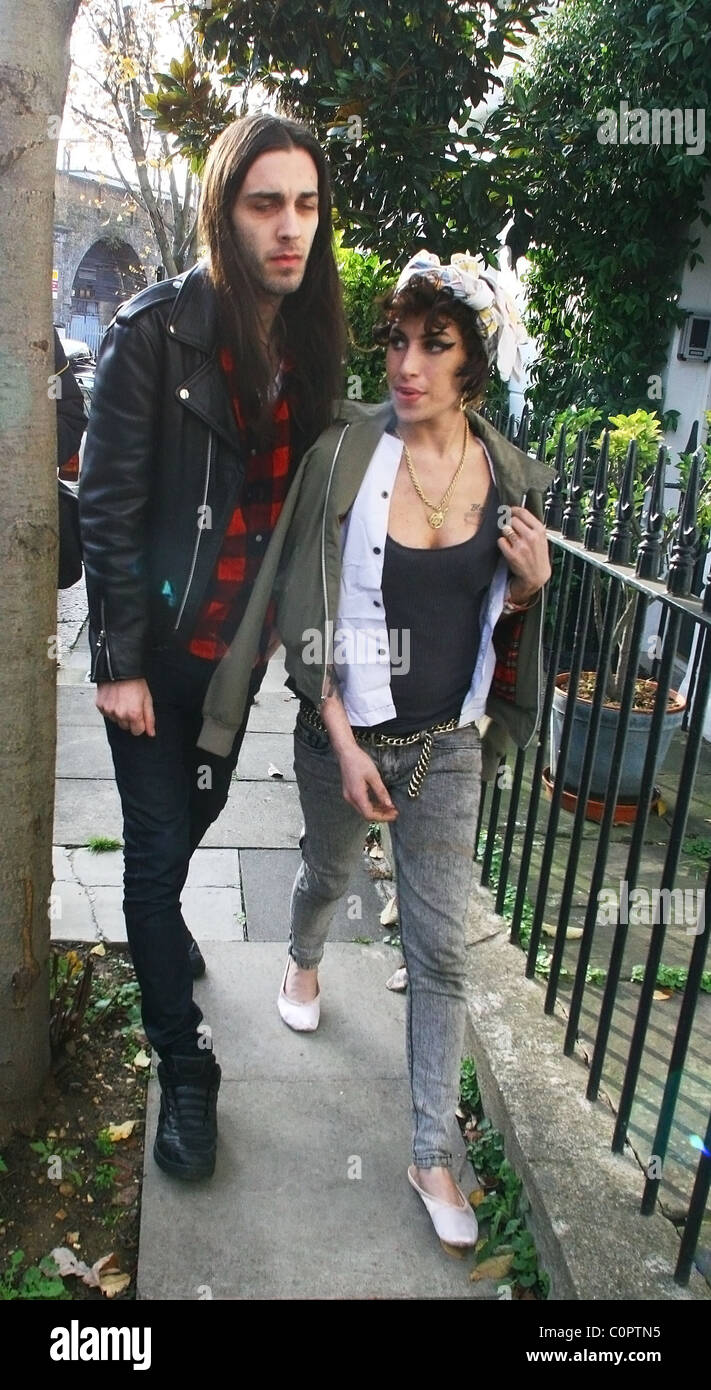 Blake Wood and Amy Winehouse looking happy as she goes for a drink in a